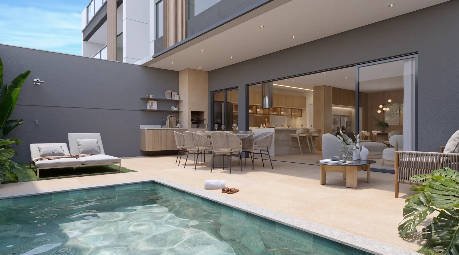 Área gourmet de uma das casas, integrada à sala, com piscina privativa e espreguiçadeiras