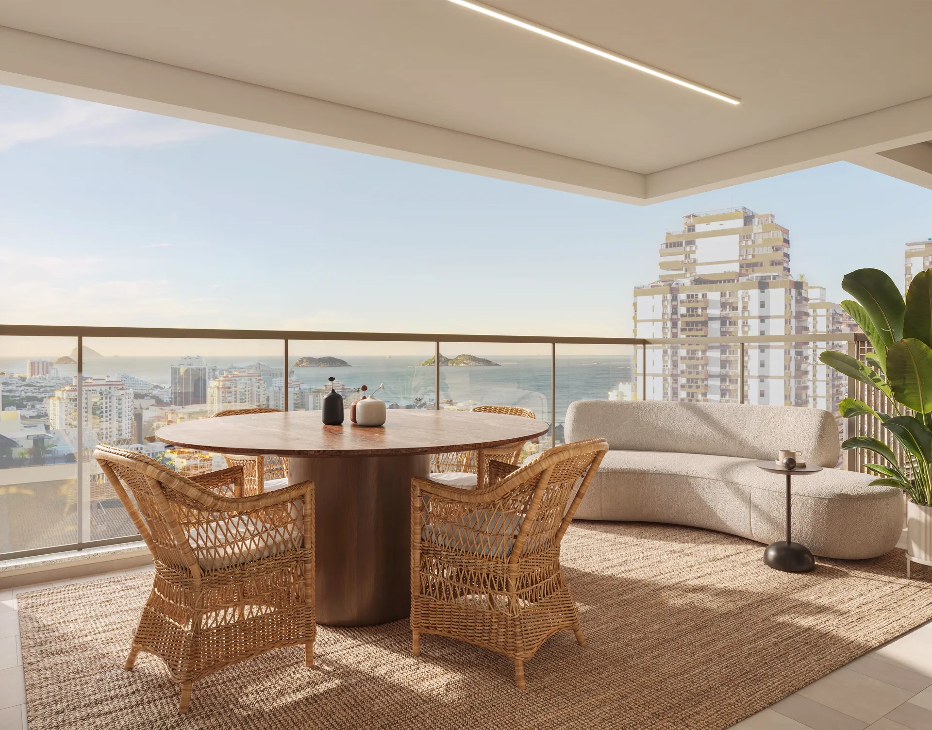 Varanda do apartamento tipo, com mesa e vista para o jardim